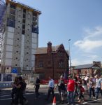 Salford May Day march goes past Fred Done apartments